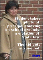 Principal of a Rhode Island High School caught smoking on school grounds, in violation of state law.  The kid who took the photos gets suspended.